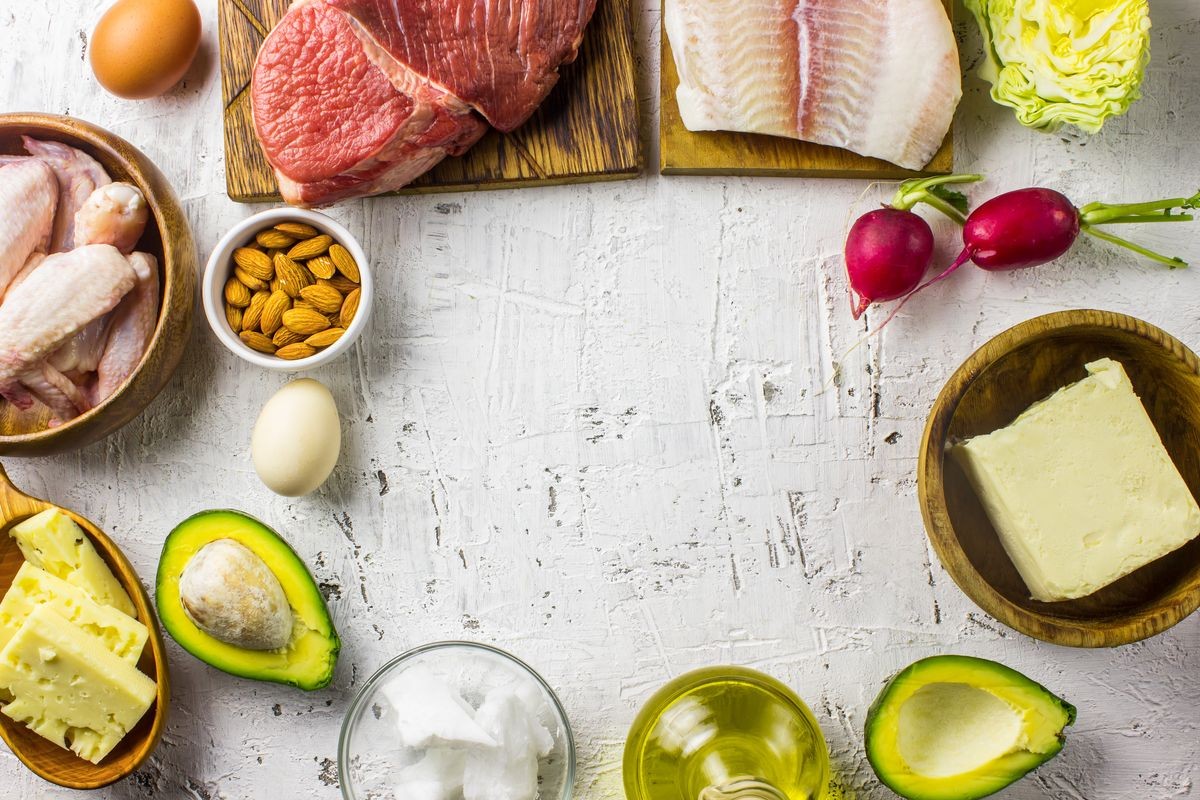  Ketogenic diet food. Balanced low-carb food background. Fish, meat, cheese, nuts on a white background. Healthy balanced food with high content of healthy fats. Diet for the heart and blood vessels.